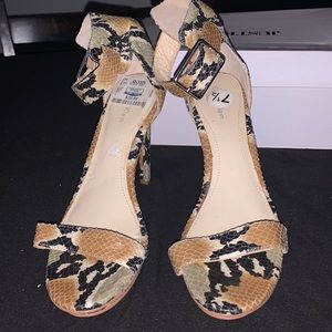 Animal print design open toe heel. Size 71/2. A Steve Madden design